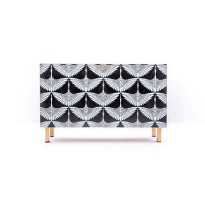 Bone inlay swan pattern credenza in black and white with all-over bird wing motif and gold metal legs on white background