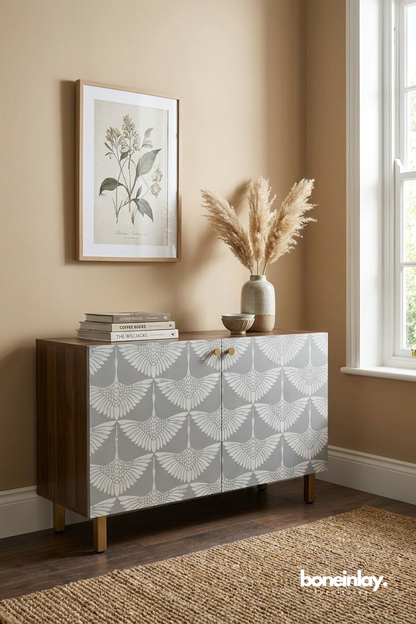 Gray and white crane motif cabinet with brass hardware and mid-century wooden frame