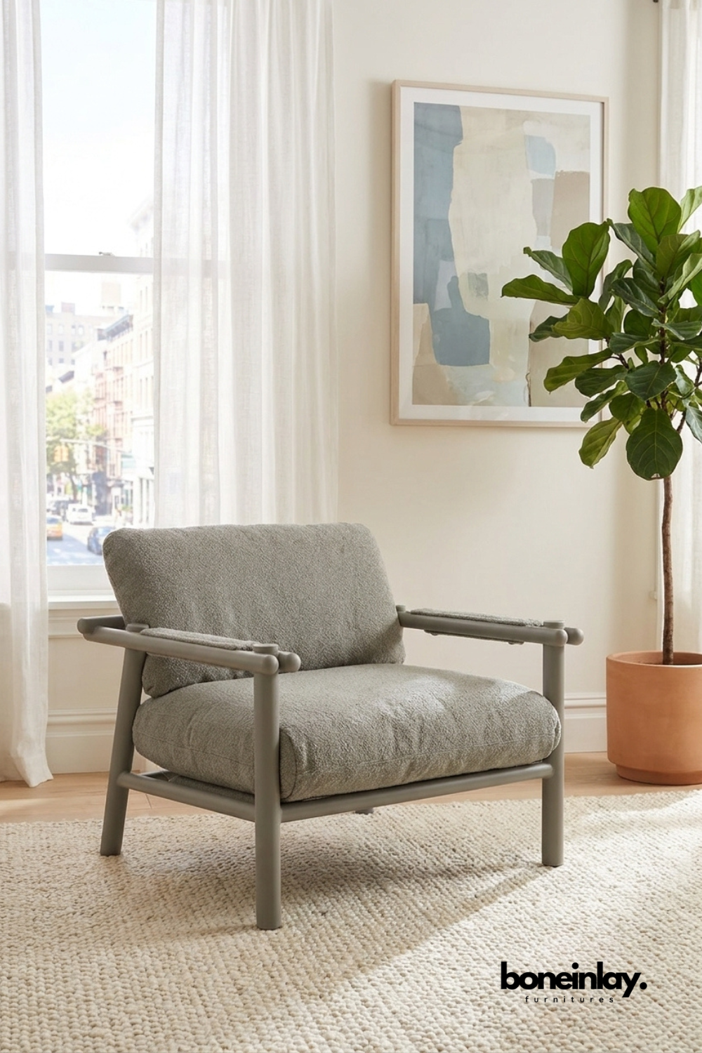 Modern gray upholstered lounge chair with rounded wood frame, contemporary accent chair featuring plush textured fabric and minimalist styling.