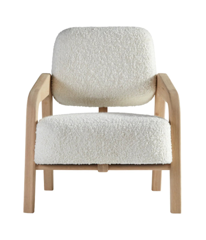 Front view of a modern lounge chair with white bouclé textured upholstery and a light-toned solid oak wood frame against a neutral background.
