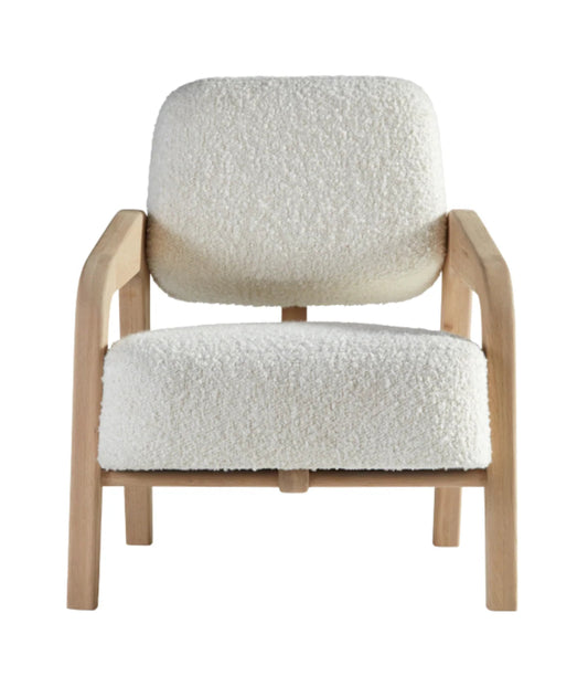 Front view of a modern lounge chair with white bouclé textured upholstery and a light-toned solid oak wood frame against a neutral background.