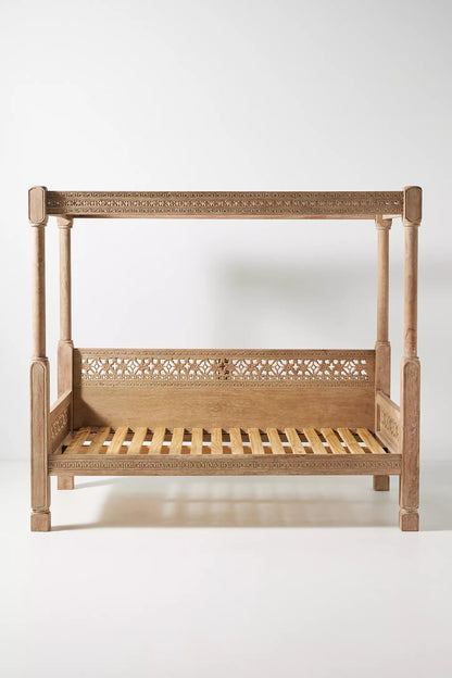 Canopy loveseat-style daybed with carved wood frame, lattice detailing, and relaxed lounge seating.