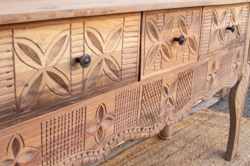 Carved Apron Console Table in rustic solid wood, edge detail view showing scalloped trim below floral drawer fronts.