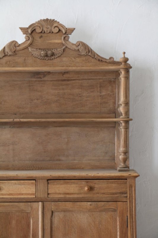 Carved crown dining hutch with open shelves above drawers and cabinet doors, centered front view.