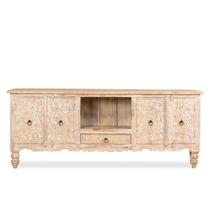 Carved Elephant TV Stand in a front view showing pale wood doors, an open center shelf and a drawer beneath.