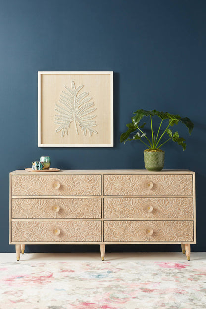 The Gulliver wood bureau has six drawers beneath a straight top, with hand-carved texture on the drawer faces.