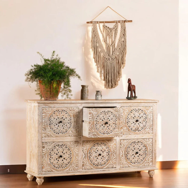 Carved medallion wood lowboy, open drawer view showing hardware and drawer interior.
