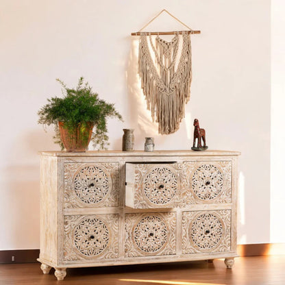 Carved medallion wood lowboy, open drawer view showing hardware and drawer interior.