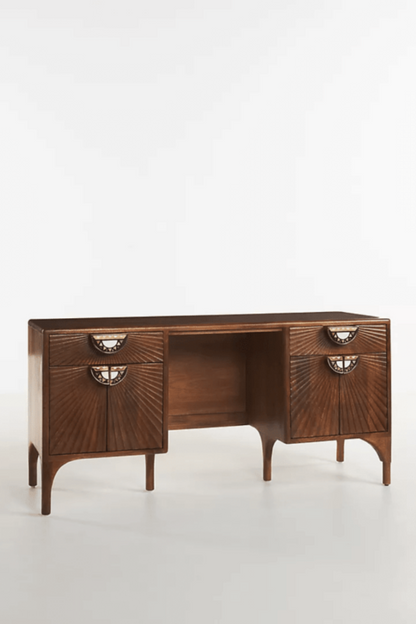 Carved Office Desk in brown hardwood, shown in a side profile view with its legs and storage visible.