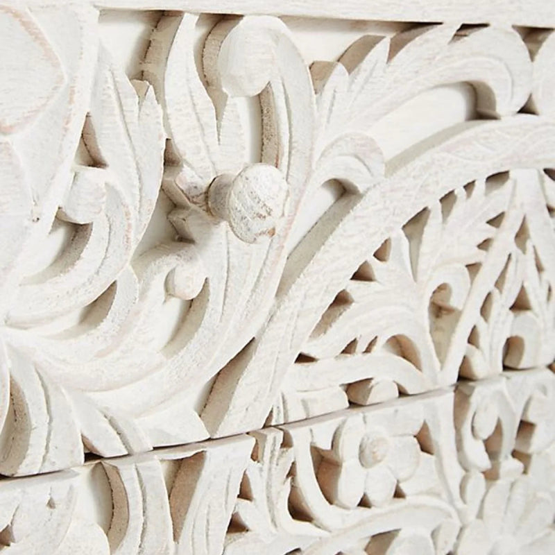 Close-up of the Lombok dresser's carved drawer front, showing the patterned wood and whitewashed finish in detail.