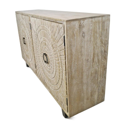 Carved wood cabinet with a pale washed finish and medallion door, viewed from the side at an angle on white.