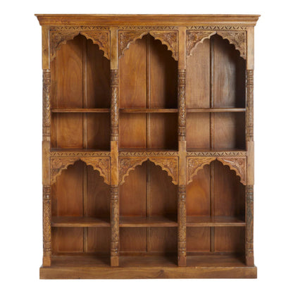 Carved wood display cabinet in warm brown, front view showing three shelf columns framed by floral arches and turned posts.