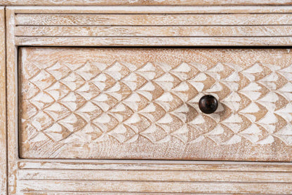 Carved Wood Media Console in distressed white, shown in a close-up of its carved drawer and surrounding trim.