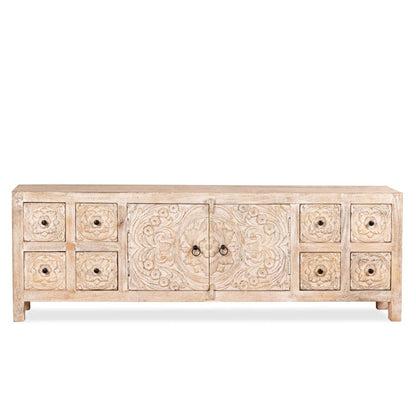 Carved wood sideboard in a front view, showing the low whitewashed cabinet, central doors and rows of drawers.