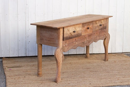 Curved Leg Sofa Table in rustic solid wood, side profile view showing the plain side panel and carved drawer fronts.