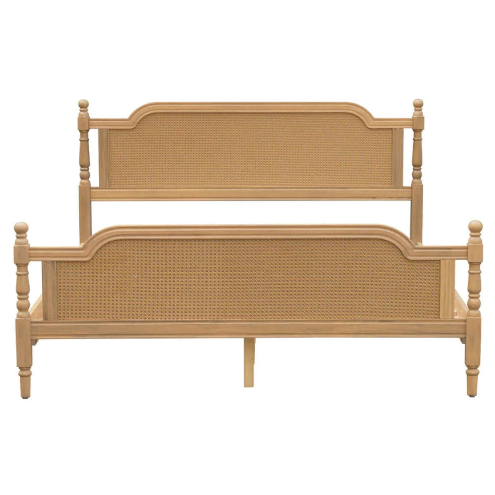 Curved rail bed frame with natural rattan panels in front view, showing the broad footboard beneath the headboard.