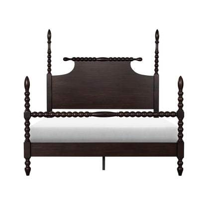 Handmade dark wood bed with four posts and spindle detailing.