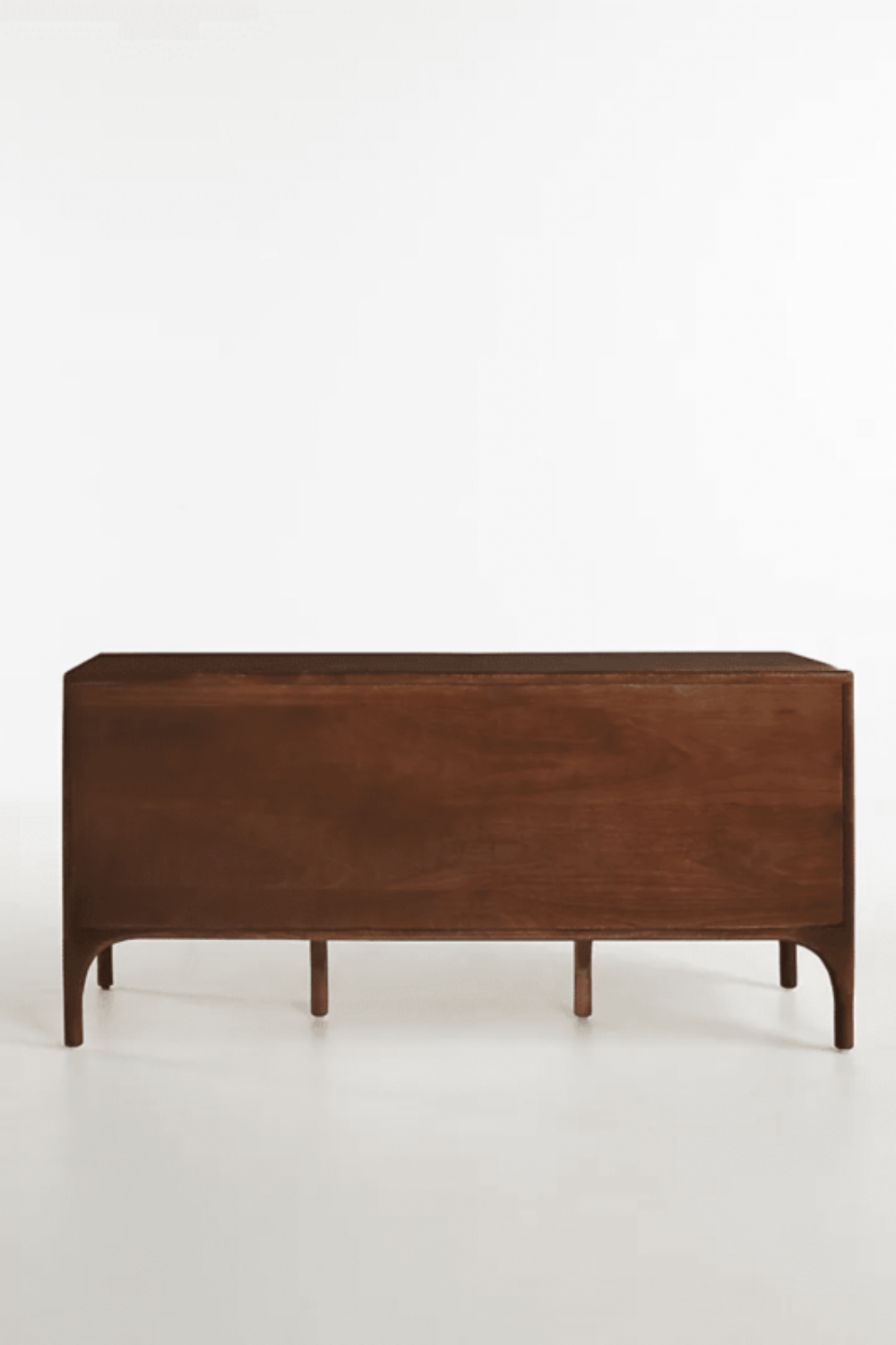 Daybreak Storage Bureau in brown hardwood, shown in a back view with its plain rear panel and supporting legs.