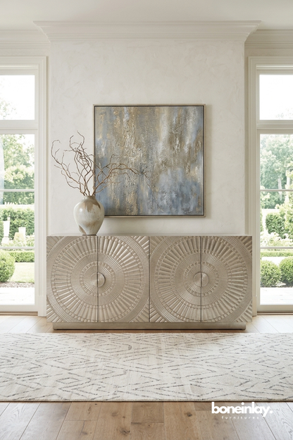 Contemporary textured sideboard showcasing elegant circular sunburst carvings in a soft neutral finish.