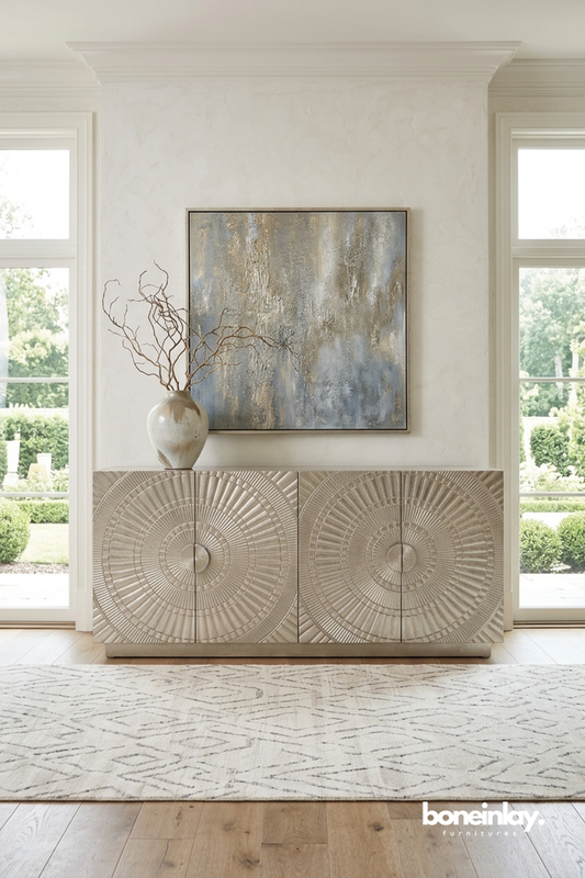Contemporary textured sideboard showcasing elegant circular sunburst carvings in a soft neutral finish.