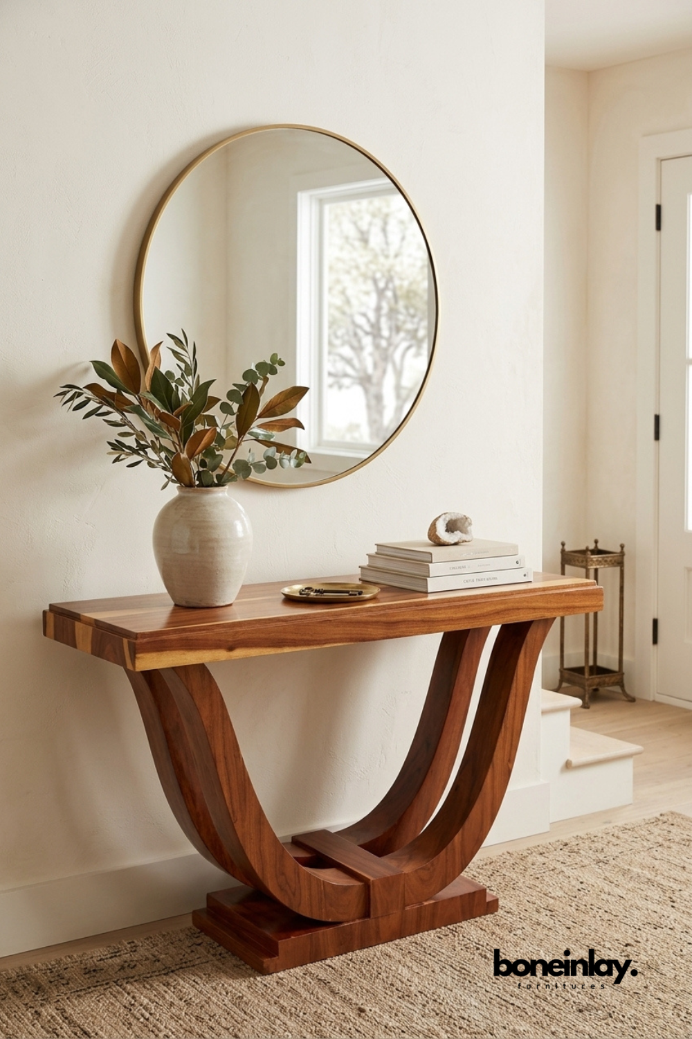 Modern solid wood console table with sculptural curved pedestal base and rich walnut finish for luxury entryway or hallway décor.