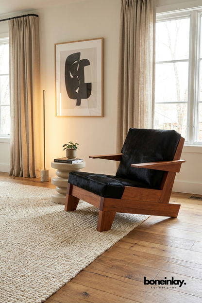 Luxury mid-century lounge chair with solid wood frame and premium black leather upholstery