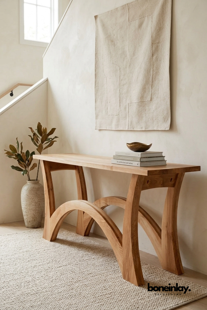 Modern solid wood console table with sculptural curved arch base and minimalist design for entryway, hallway, or living room.