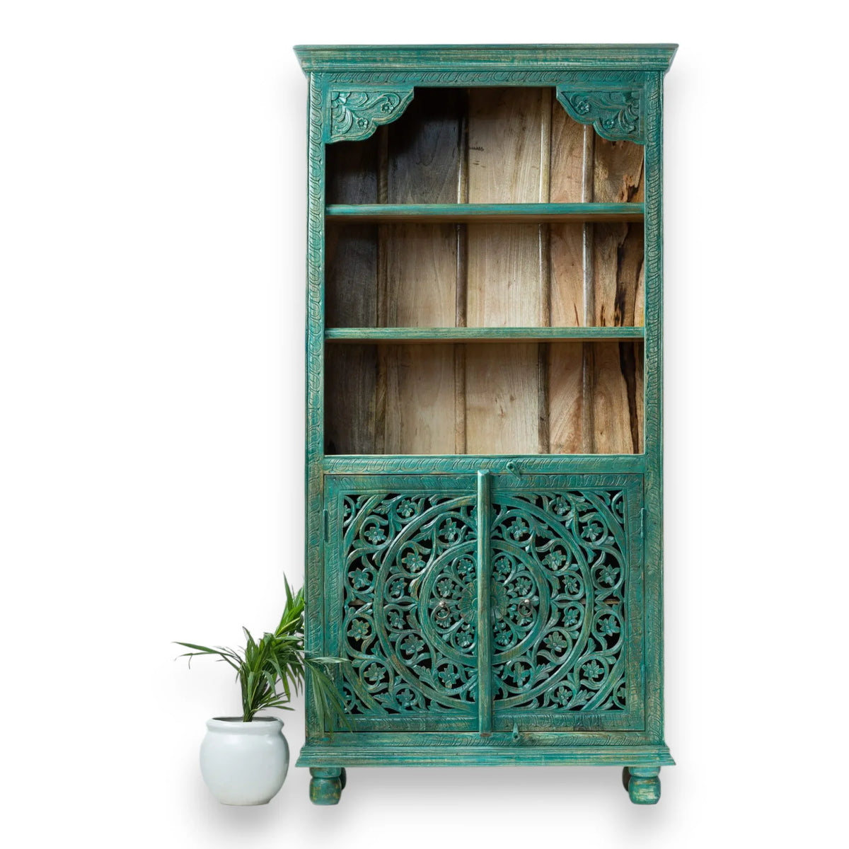Distressed teal display hutch in solid wood, front view against a striped wall with open shelves and carved doors.