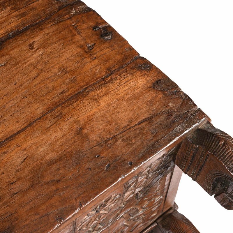 Plank top dowry chest in natural solid wood, edge detail view showing the worn top border and projecting corner.