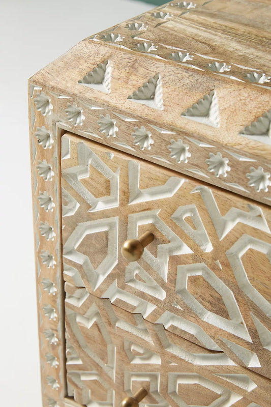 Floral Accent Table with white carved detail and brass knob, close-up showing its raised border and top detail.