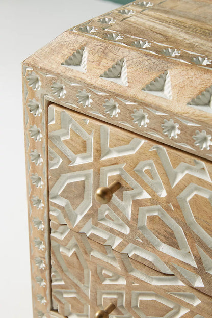Floral Accent Table with white carved detail and brass knob, close-up showing its raised border and top detail.