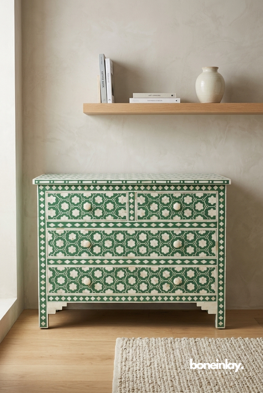 Emerald green and ivory handmade bone inlay 4 drawer dresser with trellis floral pattern, styled in a minimal bedroom with wooden shelf
