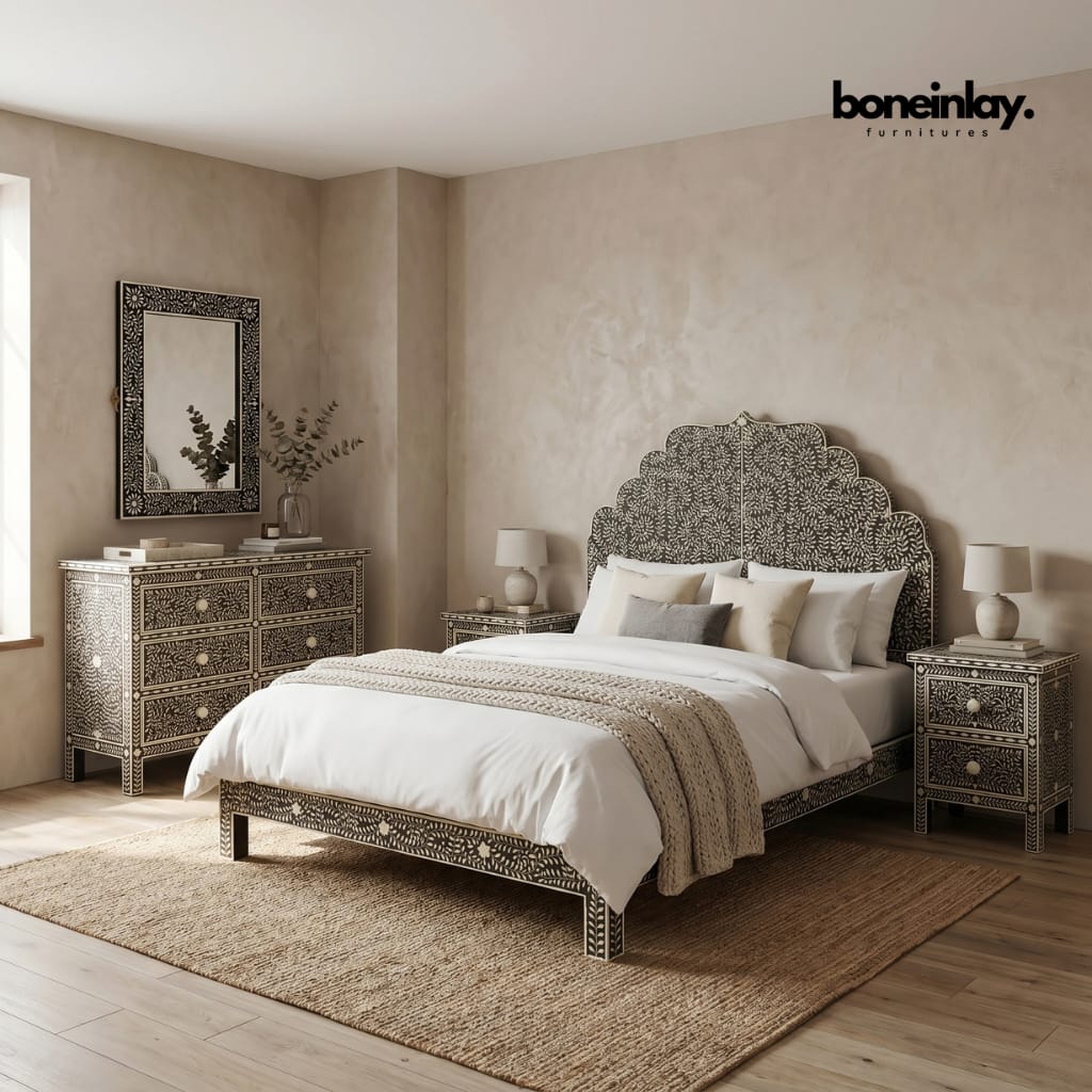 Floral bone inlay black and white bedroom set with scalloped headboard, 6-drawer dresser, two nightstands, and matching mirror in a warm neutral room