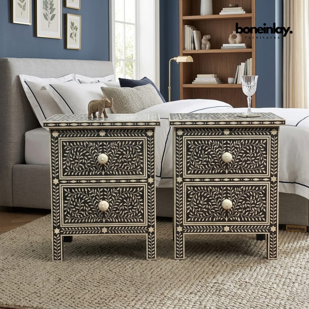 Pair of handcrafted nightstands from the Floral Bone Inlay Bedroom Set – Luxury Monochrome Sanctuary Collection, each featuring two drawers with carved bone knobs and a black resin floral vine mosaic pattern, styled beside a bed.