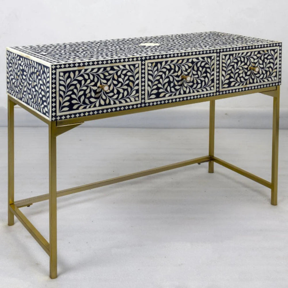 Indigo floral bone inlay console table with three drawers, white leaf vine inlay pattern, brass pull handles, and gold metal frame base