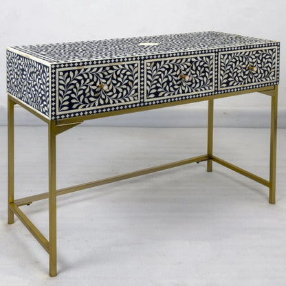 Indigo floral bone inlay console table with three drawers, white leaf vine inlay pattern, brass pull handles, and gold metal frame base