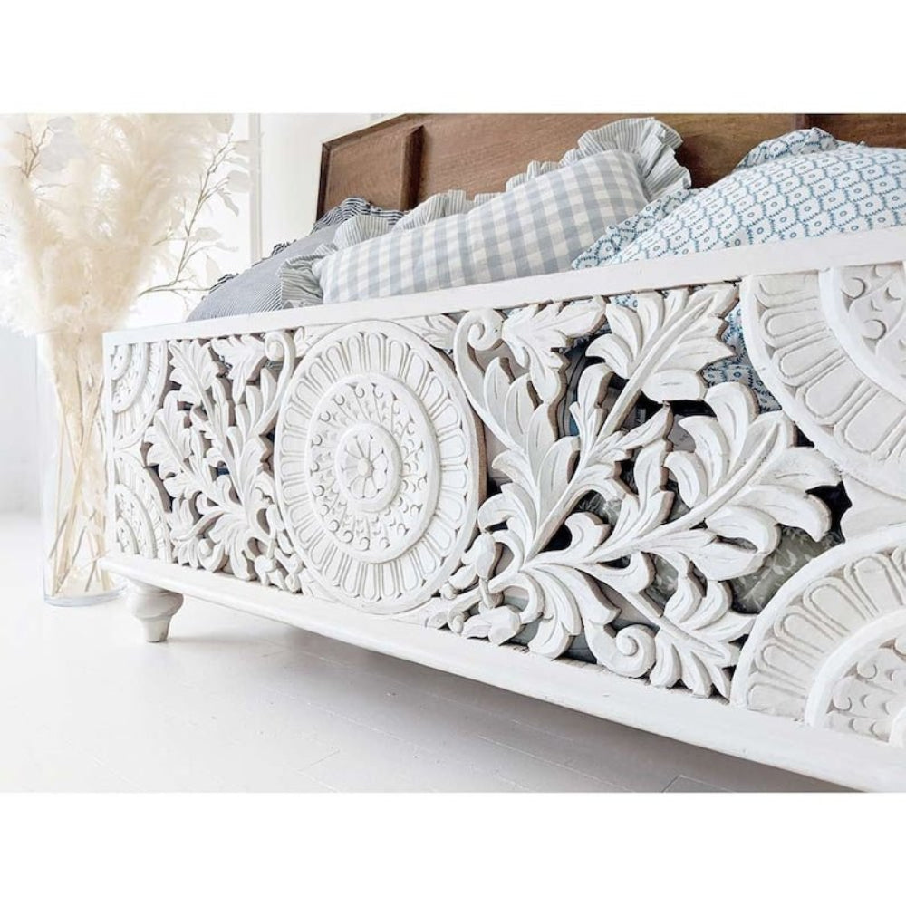 Floral Carved Hope Chest in white wood, angled front detail view highlighting leafy scrollwork and a round medallion.