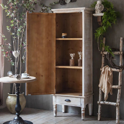 Floral carved linen cabinet with its tall wooden door open, showing interior shelves and a lower drawer.