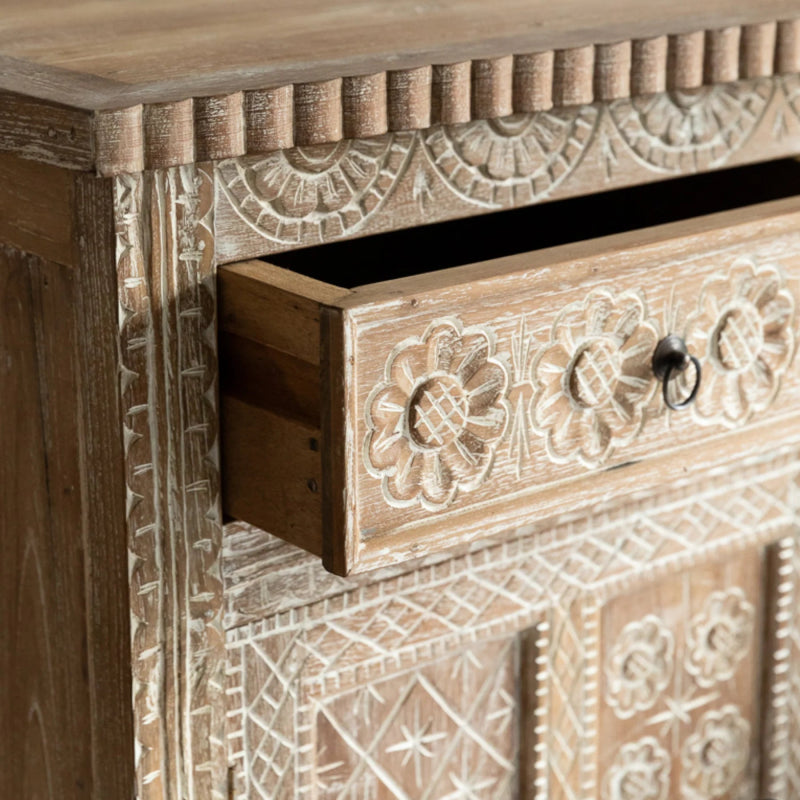 Floral carved sideboard in light wood, shown in an open drawer view highlighting the carved drawer front and pull.