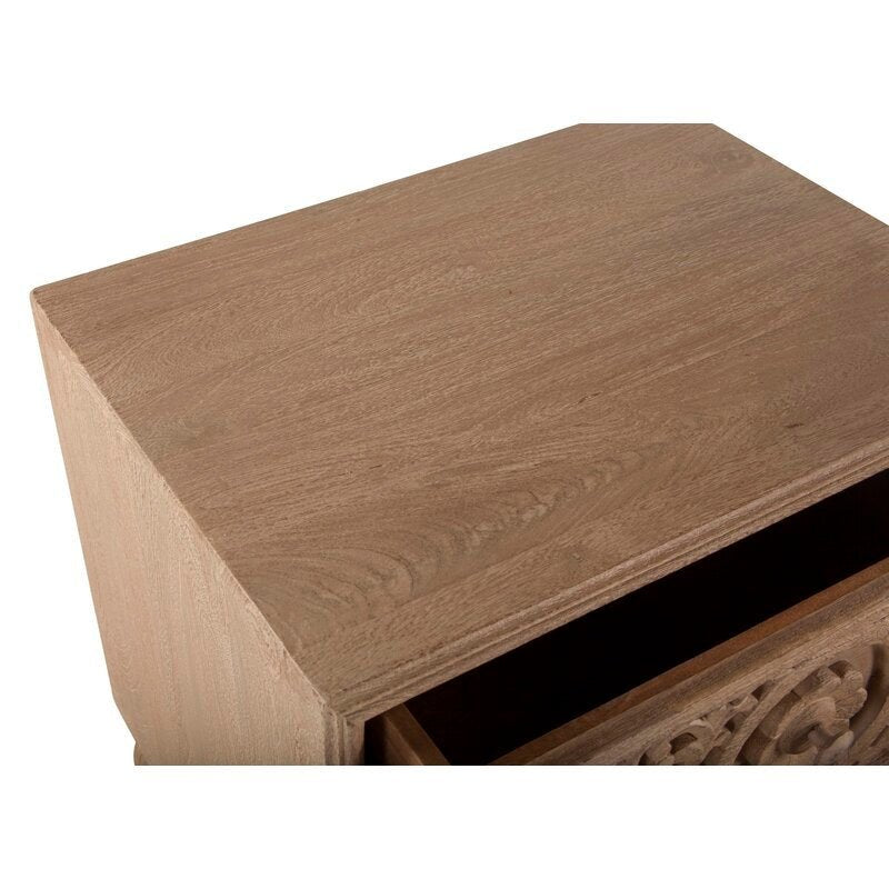 Two Drawer Wooden Night Table with a light wood finish, carved floral fronts, rounded bun feet, and wooden construction