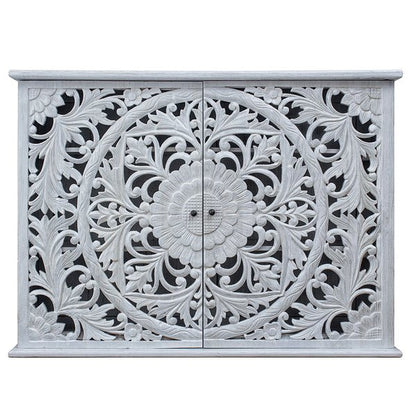 Floral wooden sideboard in rustic, front view showing two carved doors with a circular flower motif.