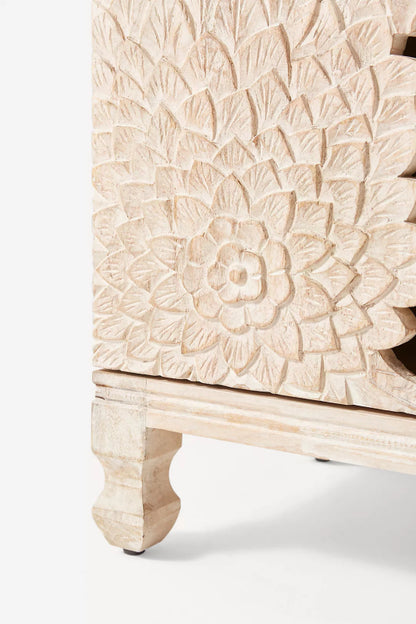 Four-Door Lotus Cabinet in wood, shown in a close-up view of the carved floral panel and surrounding door frame.