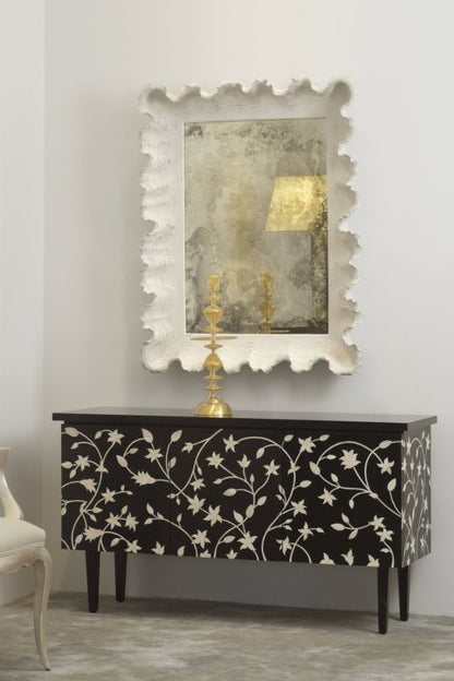 French style bone inlay buffet table featuring white floral vine inlay on deep black mango wood, styled with ornate mirror and brass candlestick