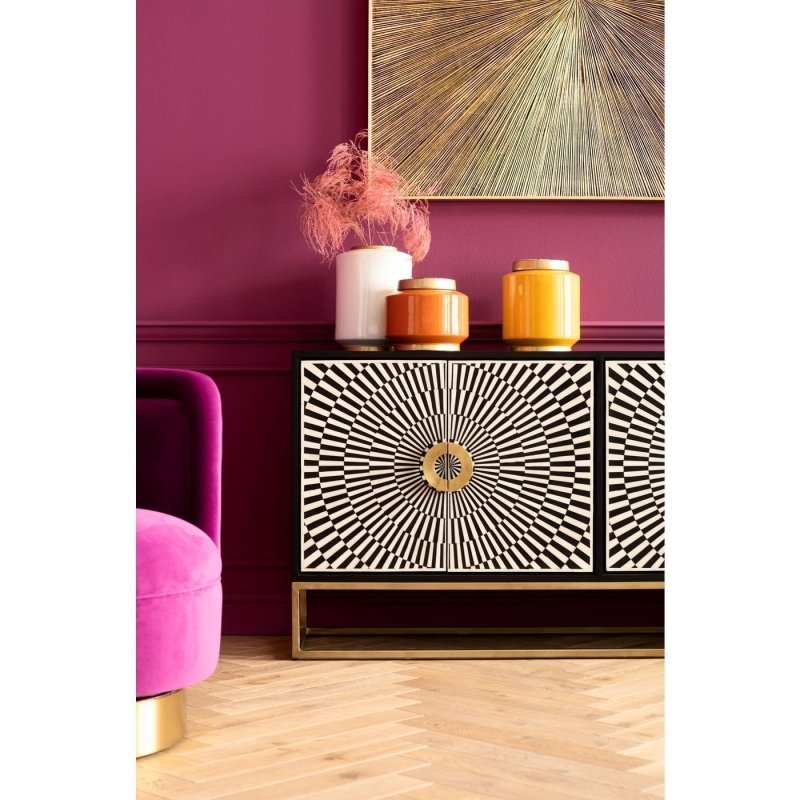 Geometric bone inlay sideboard in black and ivory with starburst pattern, gold circular door pulls, and gold-finished slim metal base