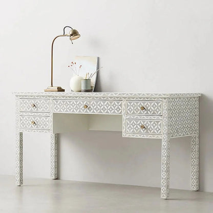 Handmade bone inlay geometric writing desk with 5 drawers and brass hardware, featuring an all-over diamond motif in grey and white, styled with a gold desk lamp and vase