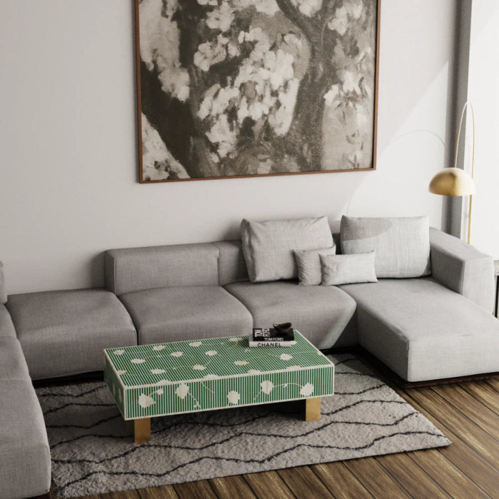 Green striped floral bone inlay center table with brass legs placed in a contemporary grey living room — artisan-crafted mango wood furniture.
