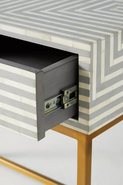 Open drawer detail of grey striped bone inlay console table showing smooth metal glide mechanism and gold frame
