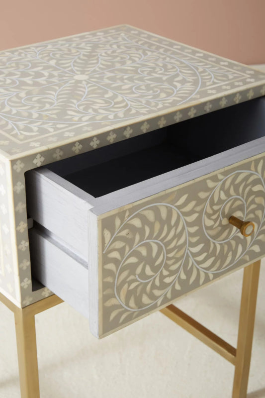 Grey bone inlay nightstand with drawer fully open showing spacious wooden interior, floral vine inlay on drawer front, and solid mango wood construction with brass frame.