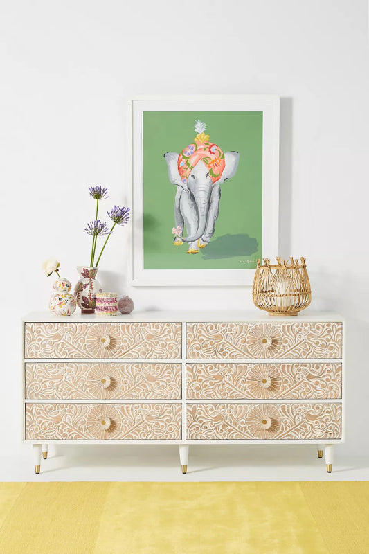 Front view of the Gulliver six-drawer dresser in natural wood, with textured hand-carved drawer fronts.