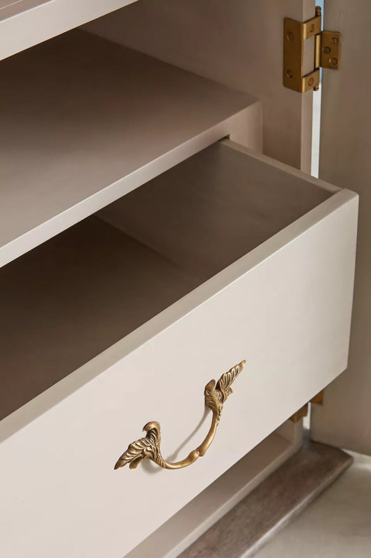 Hand-Carved Drawer Wardrobe in a light wood finish, close-up of an open drawer showing its wood interior and brass pull.